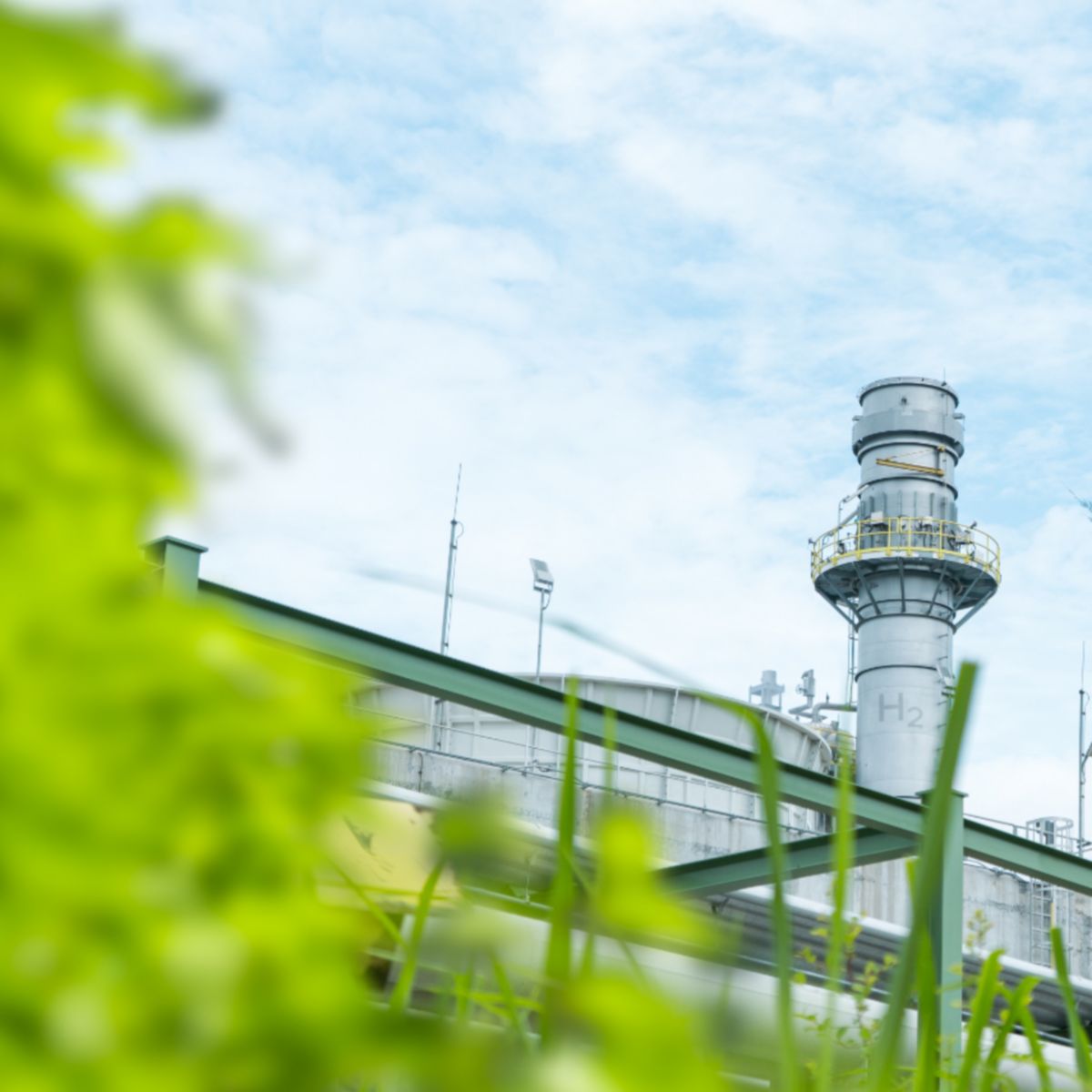 Large gas production building surrounded by greenery