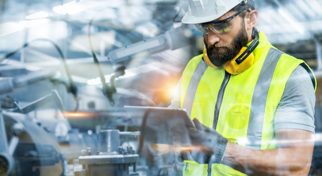 Manager or Industrial engineer working and control robotic with industry factory and network connection automation robot arm by tablet. AI, Artificial intelligence.