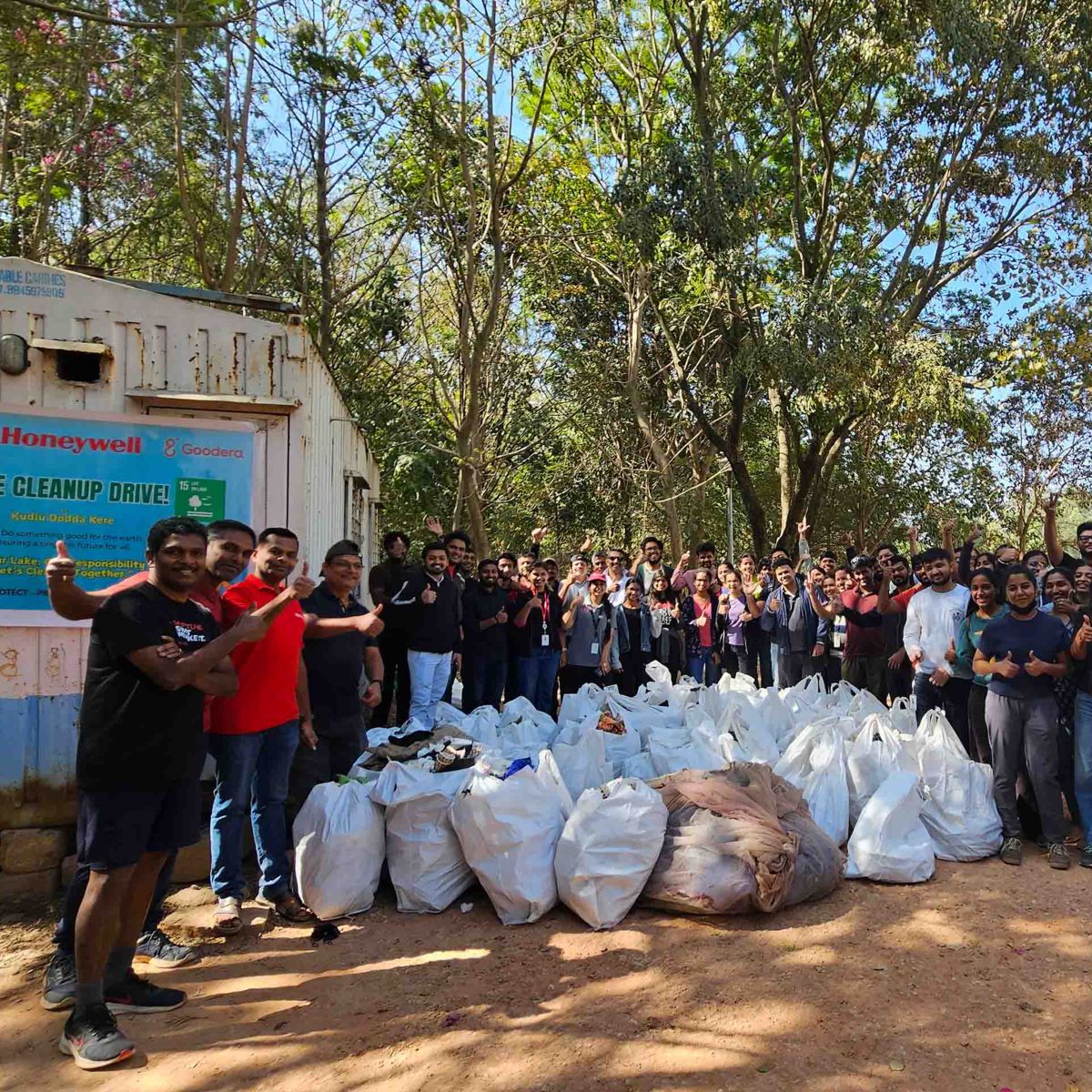 Volunteers gather for a lake cleanup drive, celebrating their efforts to protect the environment and improve local ecosystems.