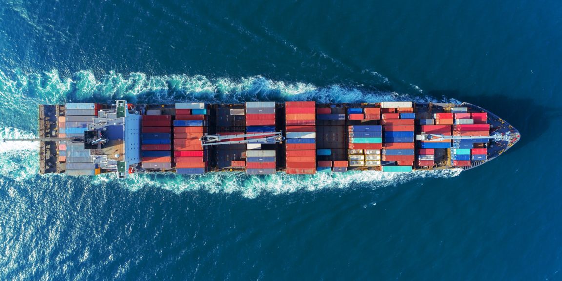 Aerial view Top speed with beautiful wave of container ship full load container with crane loading container for logistics import  export or transportation concept background.