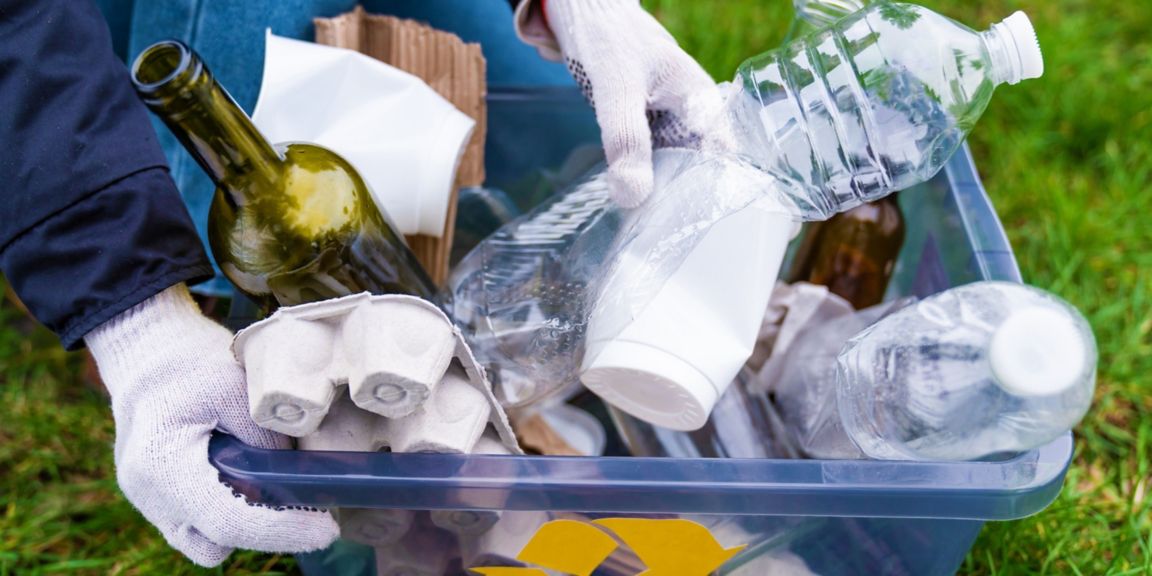 Plastic waste in a recycling bin.