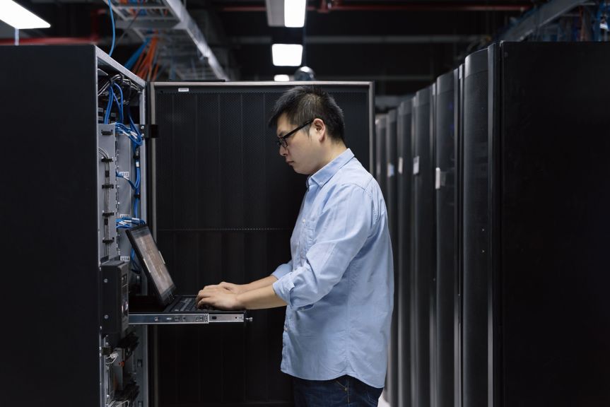 hon-it-technician-laptop-server-rack-data-centre-336203844.jpg