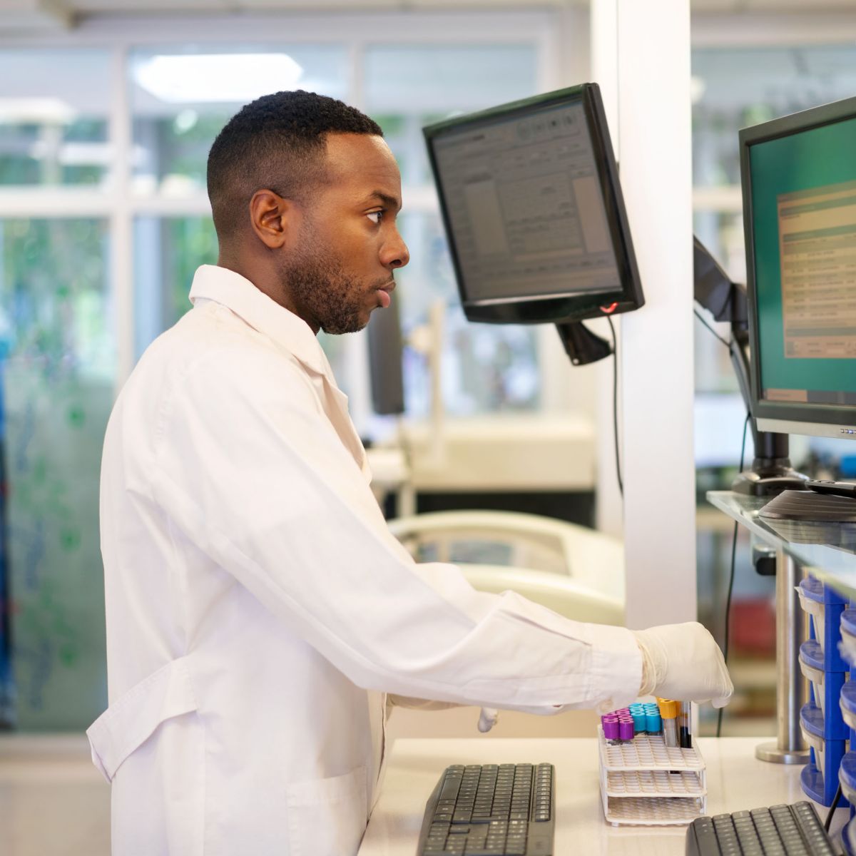 hon-lab-technician-analyzing-blood-samples-computer-screen-1371703280.jpg