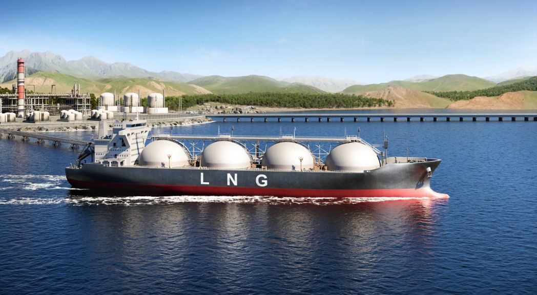 A large liquefied natural gas carrier departs an industrial coastal facility set against a backdrop of rolling mountains.
