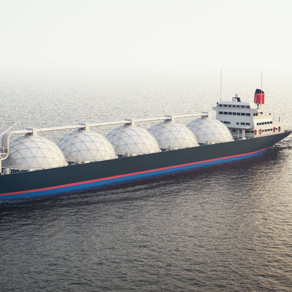 A large liquefied natural gas carrier ship sailing across a calm ocean during daylight.