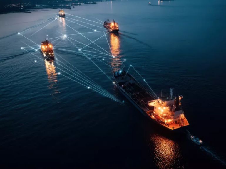 Connected vessels at sea using digital communications networks, highlighting maritime cybersecurity, satellite connectivity, and secure operational visibility.