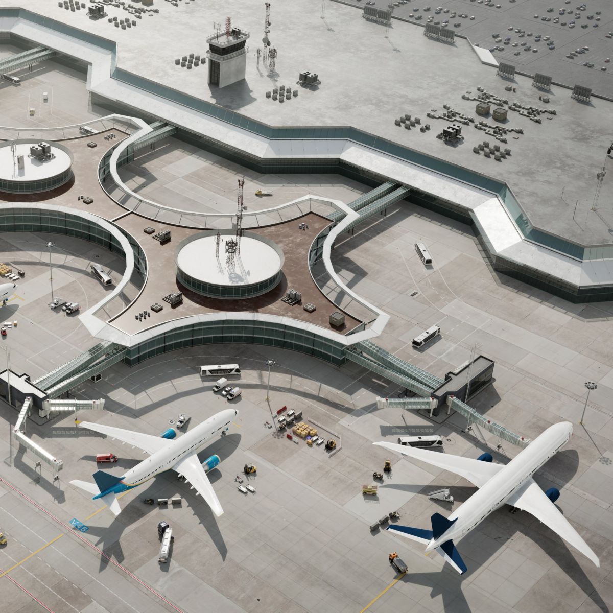 An aerial view showcasing commercial airplanes parked at a geometric airport terminal with ground support vehicles operating on the concrete tarmac.
