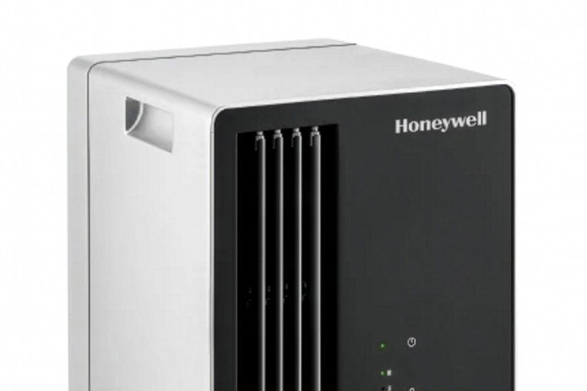 Honeywell personal evaporative air cooler with a black front panel and white housing.