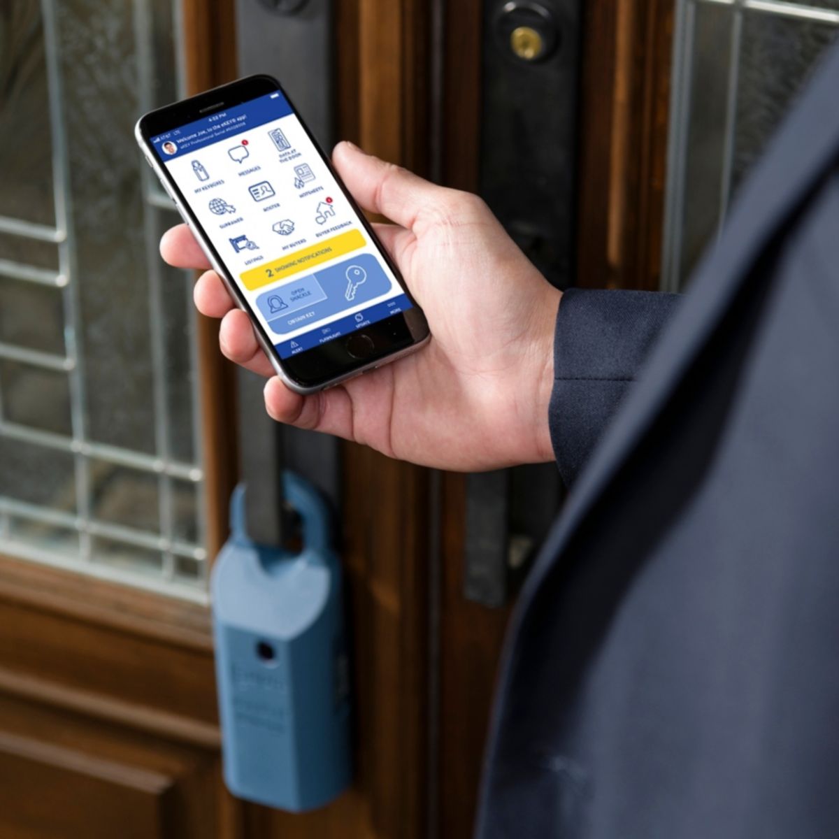 Smartphone displaying an access control app used to manage door entry, shown next to a physical lock on a residential or office doorway.
