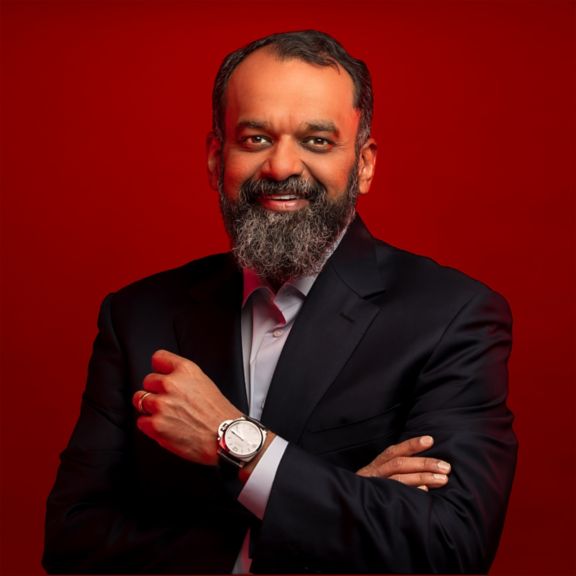 High-quality bio photo of Suresh Vankatarayalu in a formal business setting.