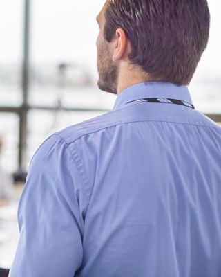 Business man making a presentation at office. Business executive delivering a presentation to his colleagues during meeting or in-house business training, explaining business plans to his employees. 