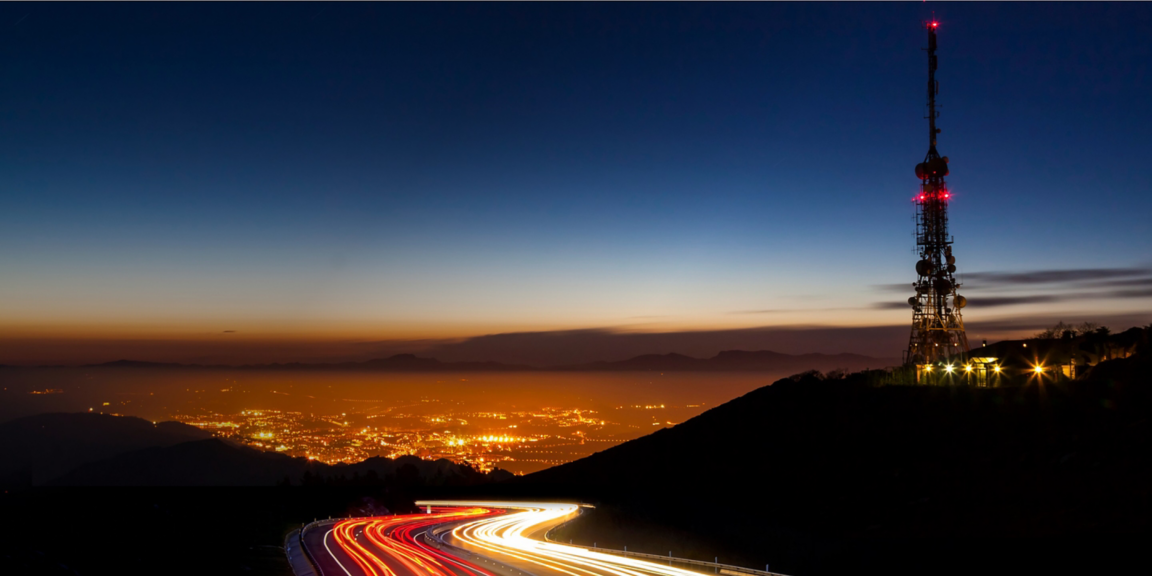 Highway to city at night