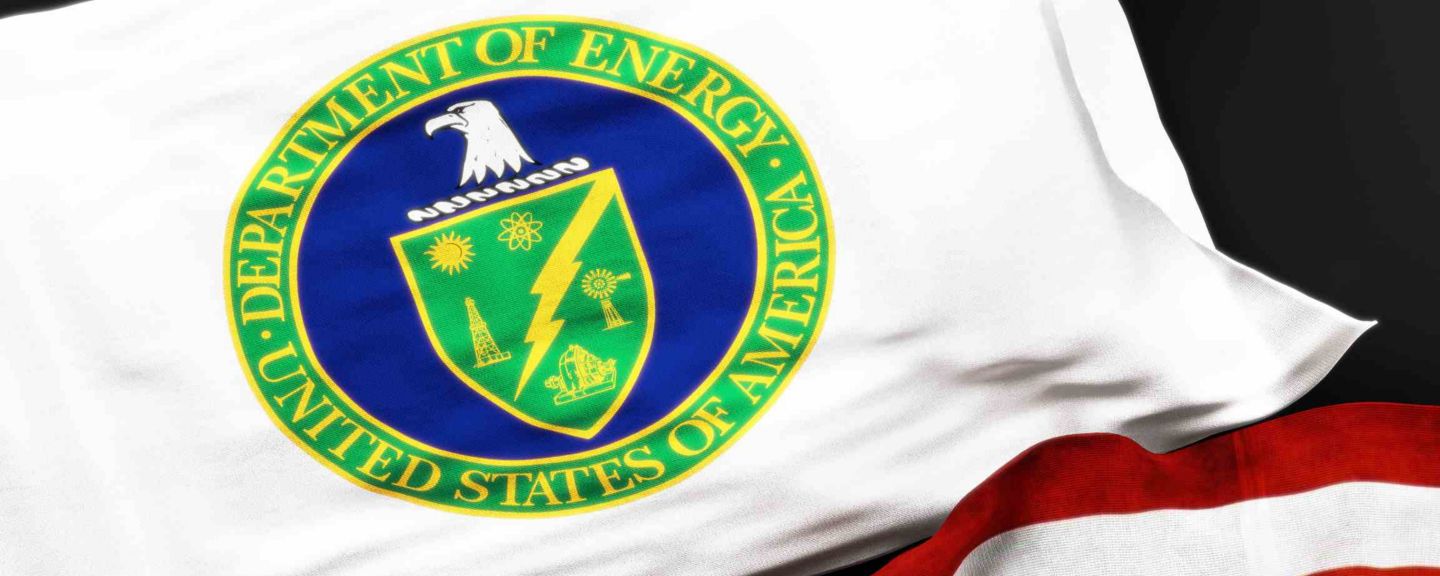 Flag of the United States Department of Energy along with a flag of the United States of America as a symbol of a connection between them