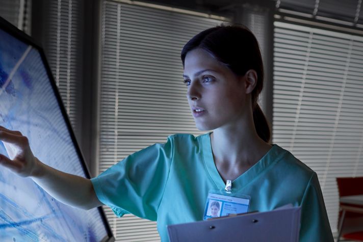 Healthcare professional using touchscreen