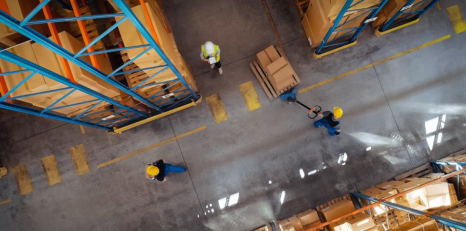 Top-Down View: In Warehouse People Working, Forklift Truck Operator Lifts Pallet with Cardboard Box. Logistics, Distribution Center with Products Ready for Global Shipment, Customer Delivery