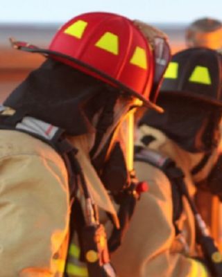 firefighters trying to stop a fire hero