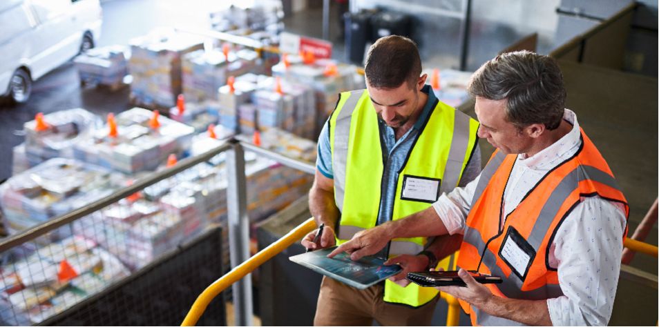 Workers talking in distribution center