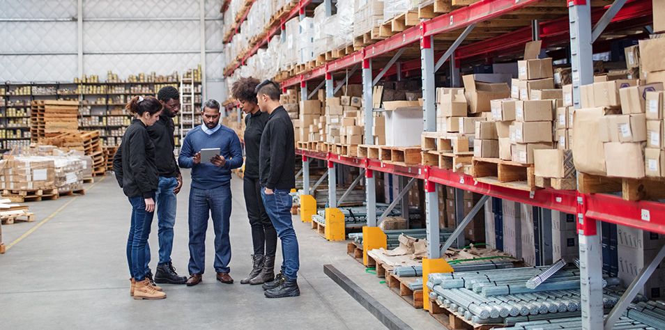 Workers talking in distribution center