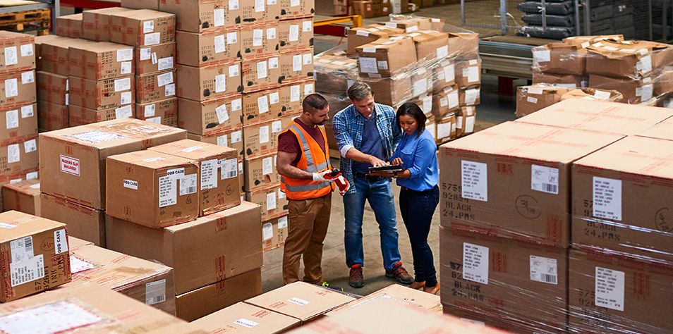 Workers in distribution center talking