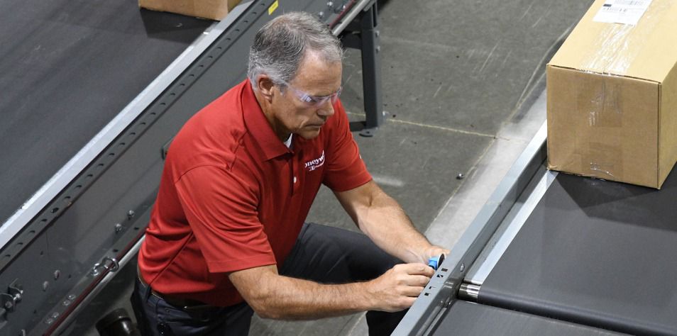 Man assesses conveyor equipment