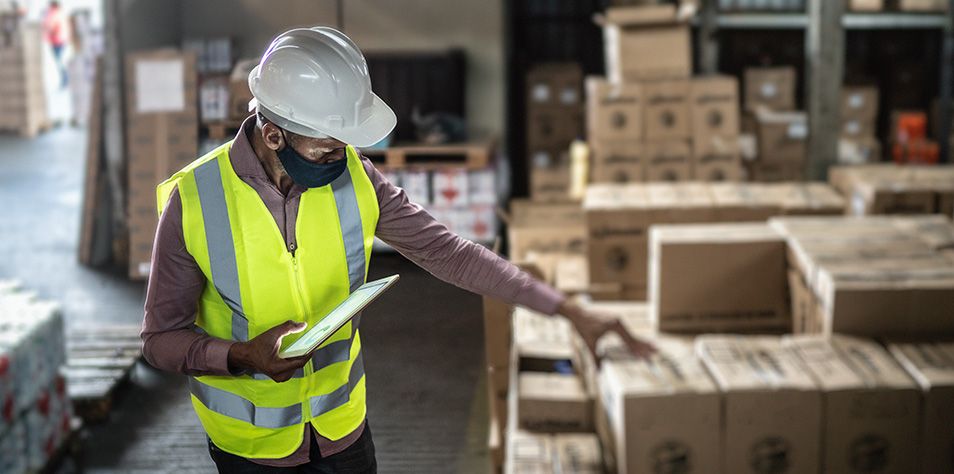 Man takes inventory in distribution center