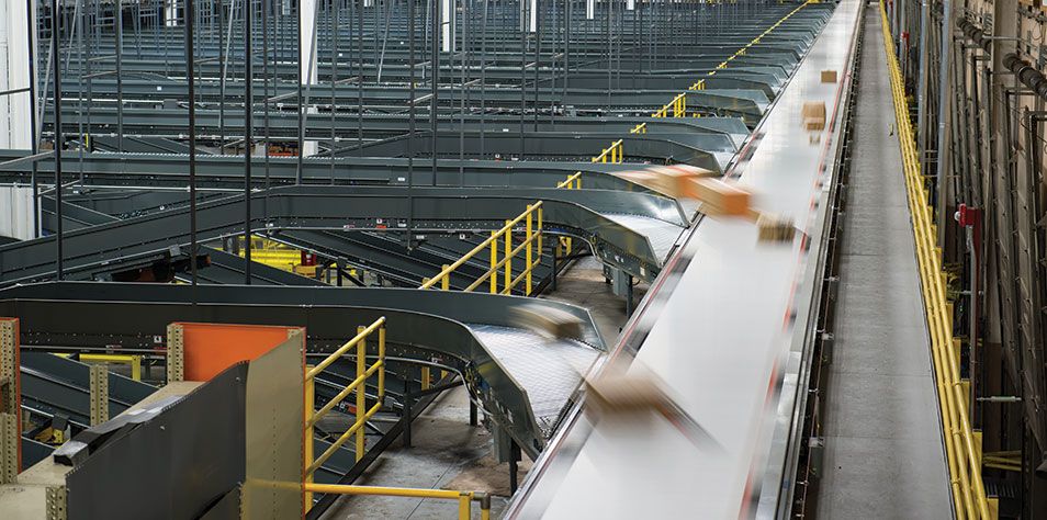 Sortation system in distribution center diverting boxes