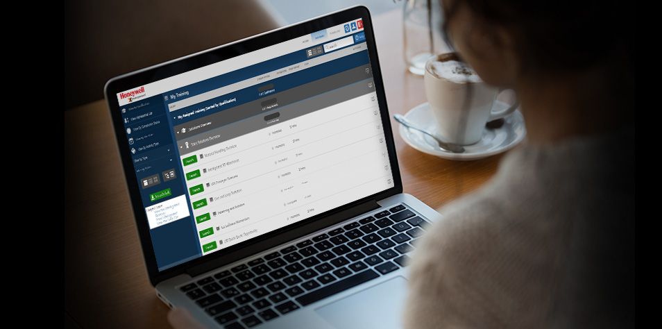 Woman completing online training on a laptop screen