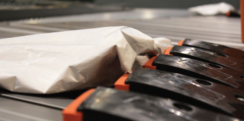 Package sitting on conveyor system