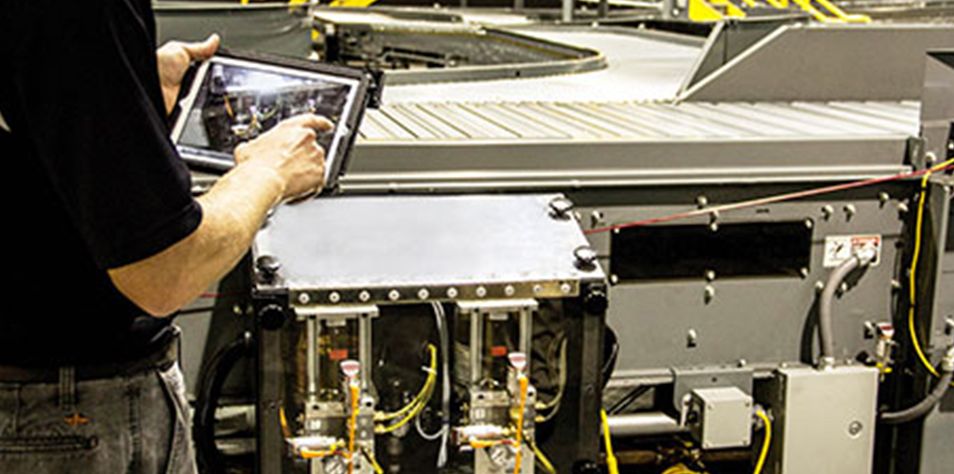 Technician in field reviewing equipment responsiveness