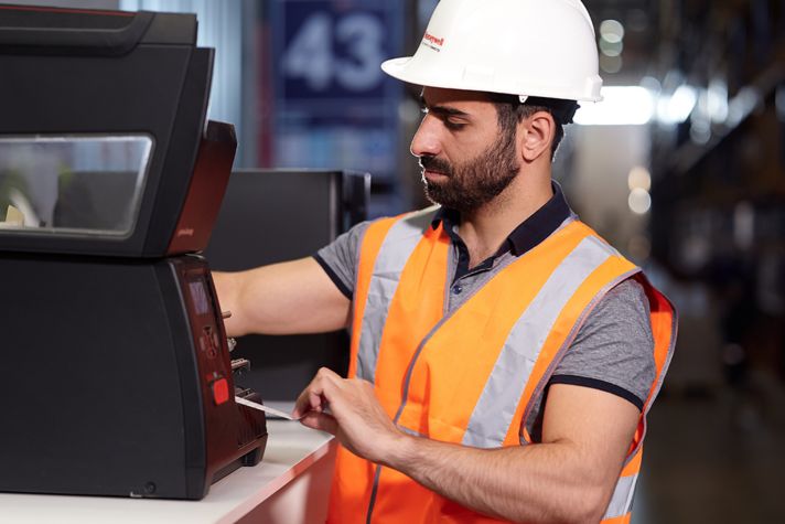 worker fixing a device