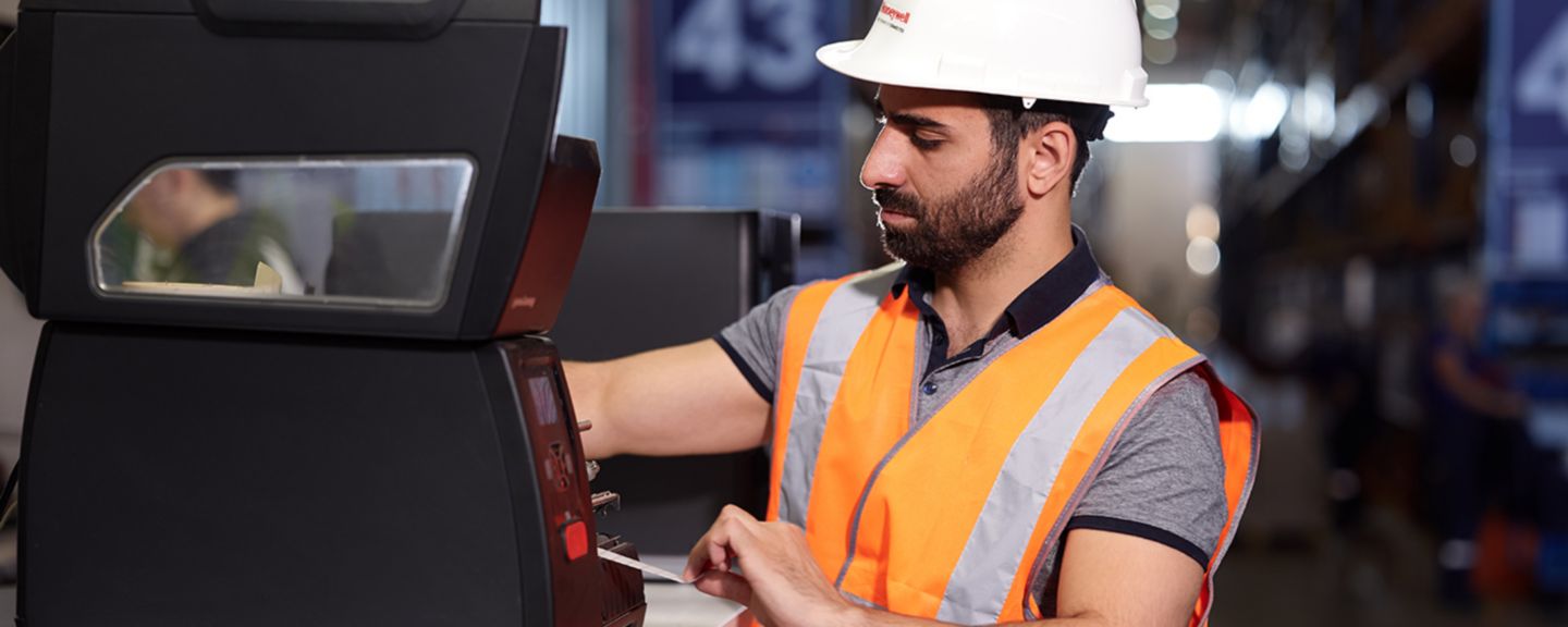 worker fixing a device