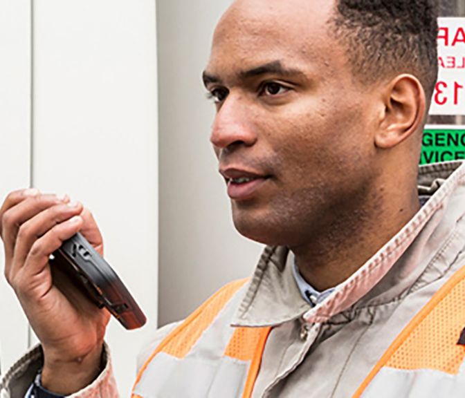 man talking to a mobile device