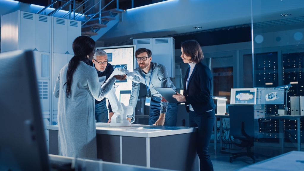 group of people talking in a medical lab