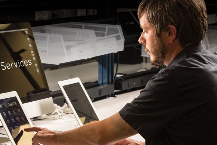 man monitoring device performance 