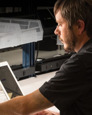 man monitoring device performance 