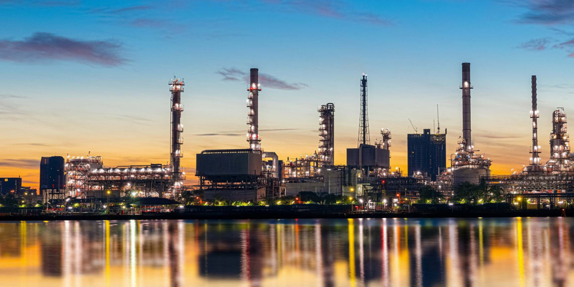 Oil and gas refinery industry plant with glitter lighting and sunrise in the morning, Factory of petroleum industrial, Power plant,Energy power station area. Industry 4.0