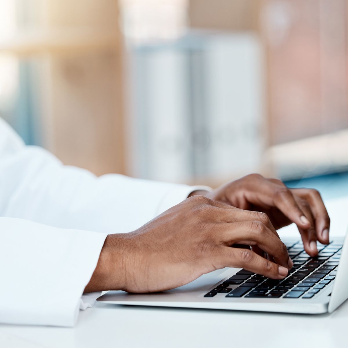 Healthcare professional using a laptop