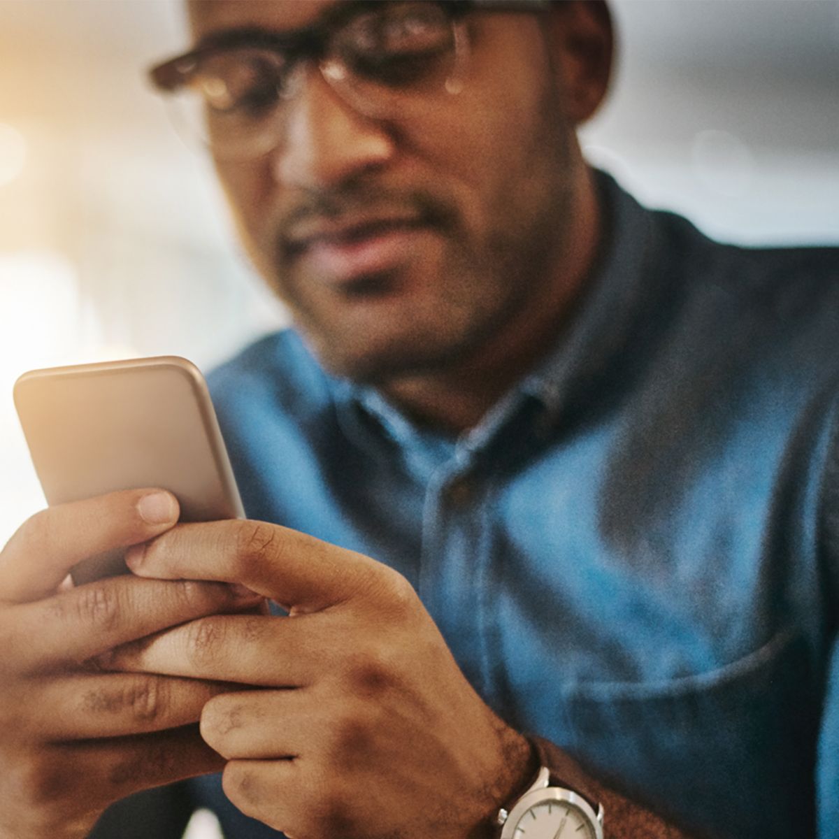 Man using handheld device