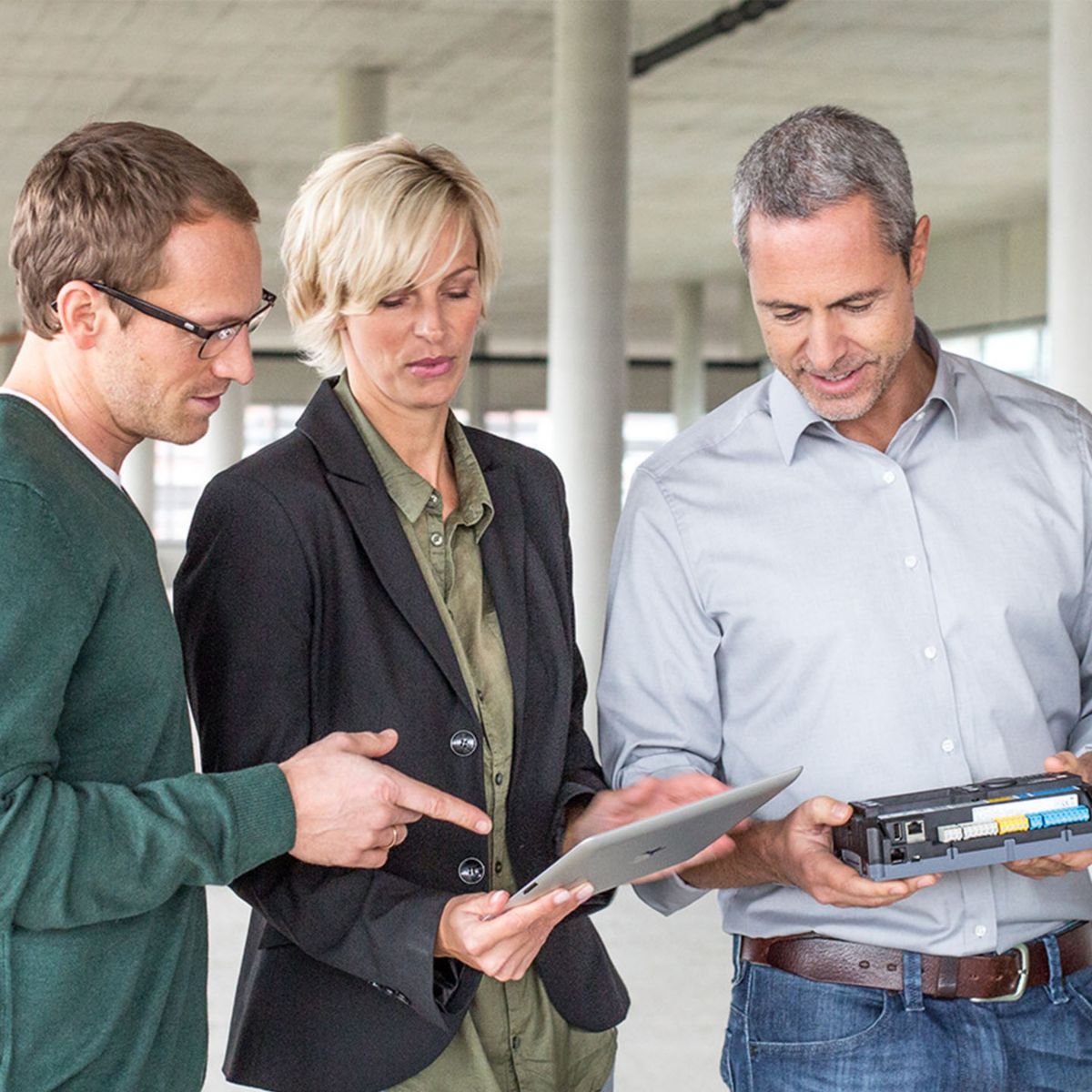 Professionals viewing tablets