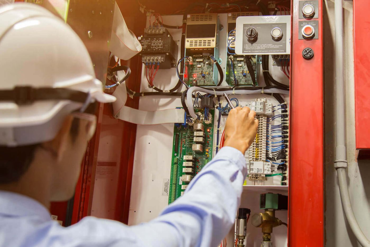 Maintenance worker checking panel