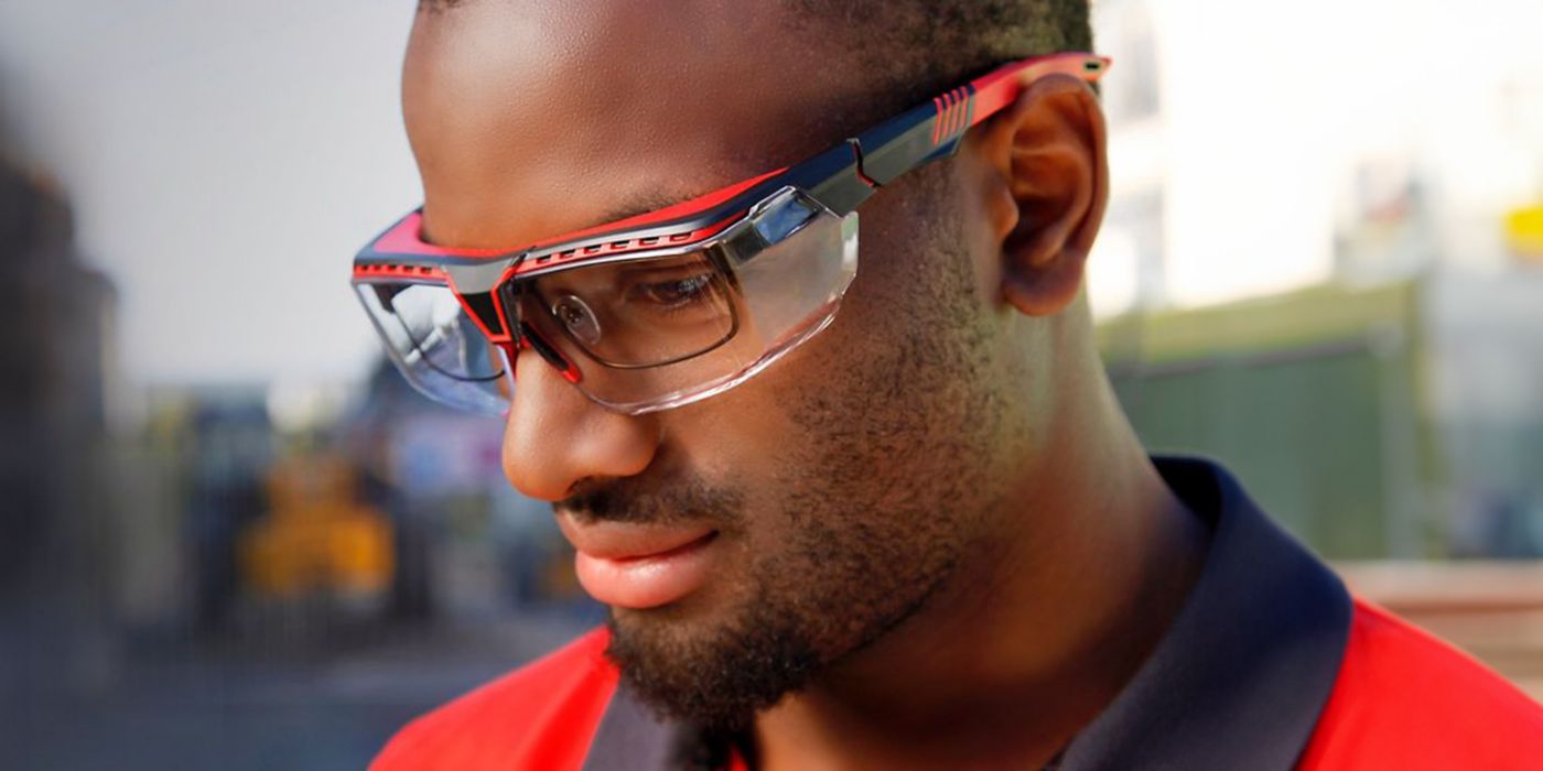 A worker wears personal protective equipment to protect their eyes.