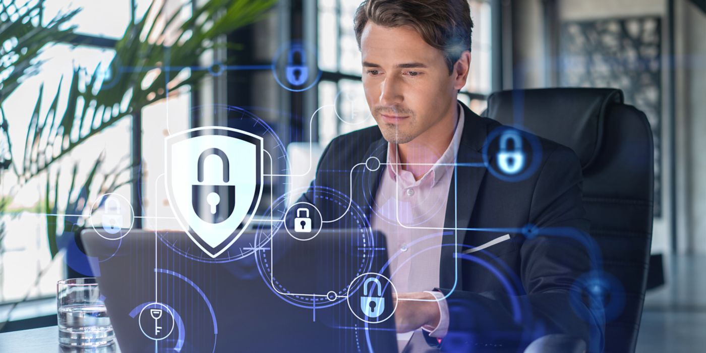 Man sitting in front of laptop for cyber security