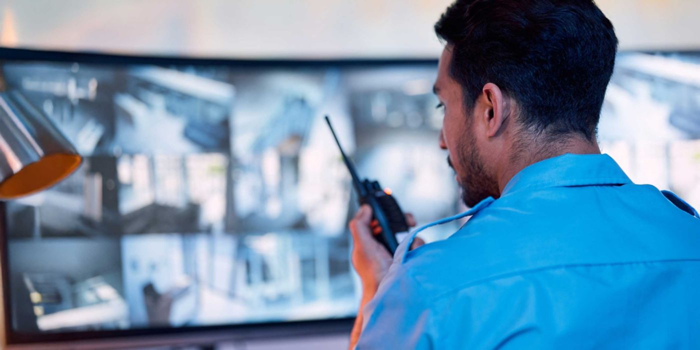 Security guard, radio and cctv screen, communication and inspection service for building safety. Monitor, video surveillance agency and law officer in control room talking on safe intercom system.