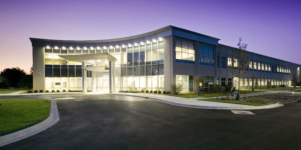 Building with lights open, seen in the evening