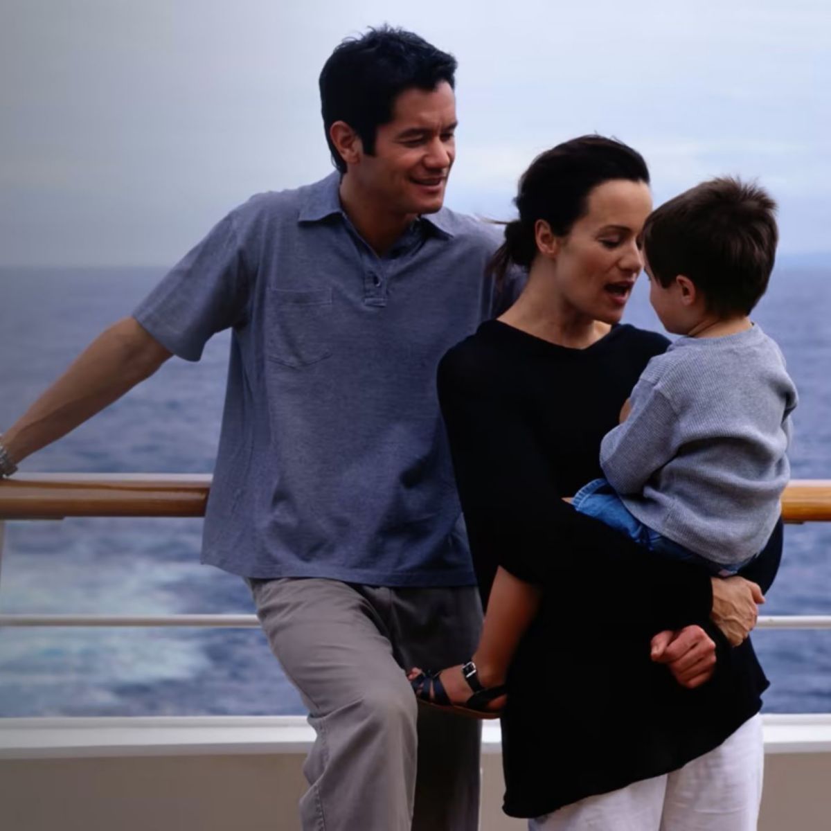 Family relaxing cruise ship couple with child