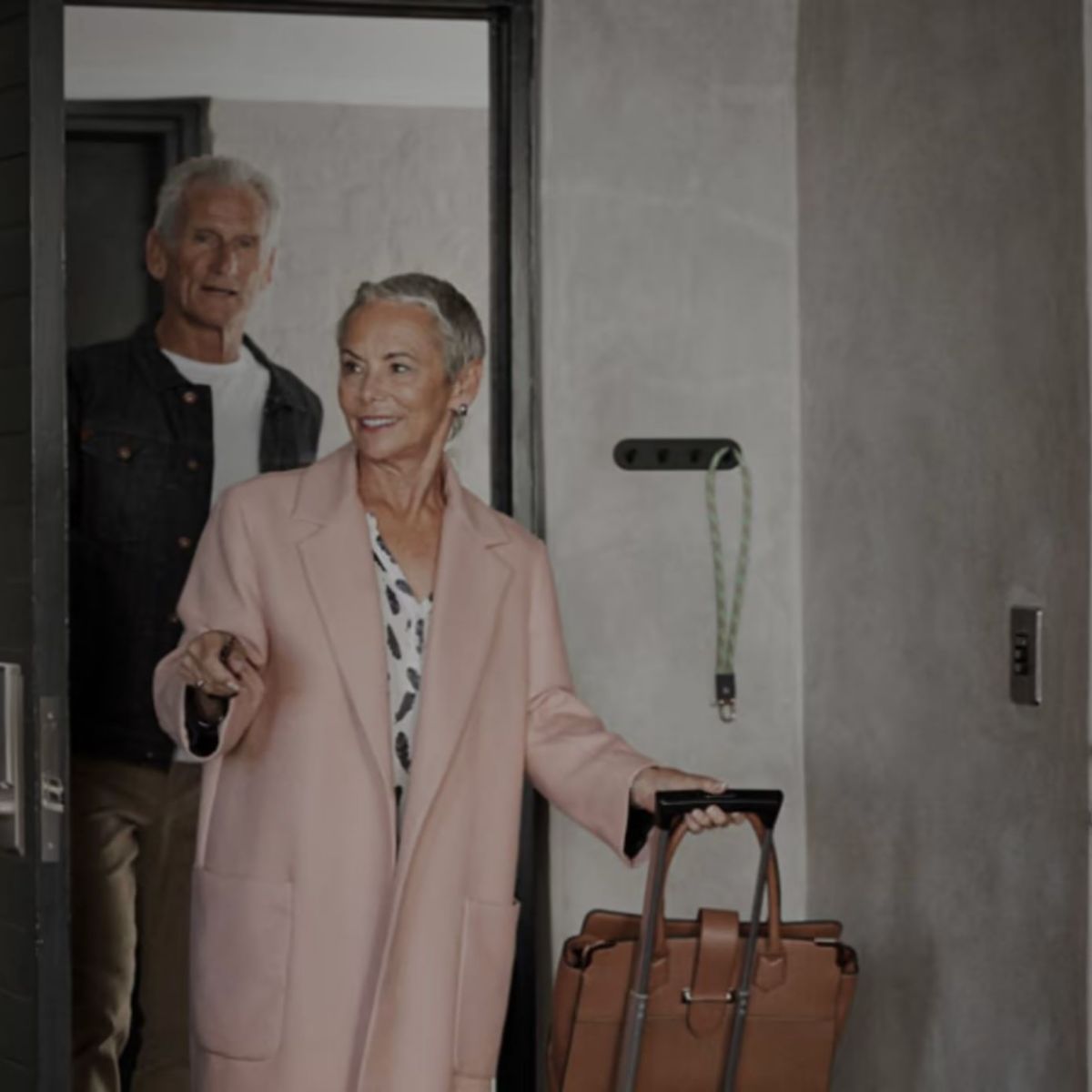 Man and woman walking into hotel room