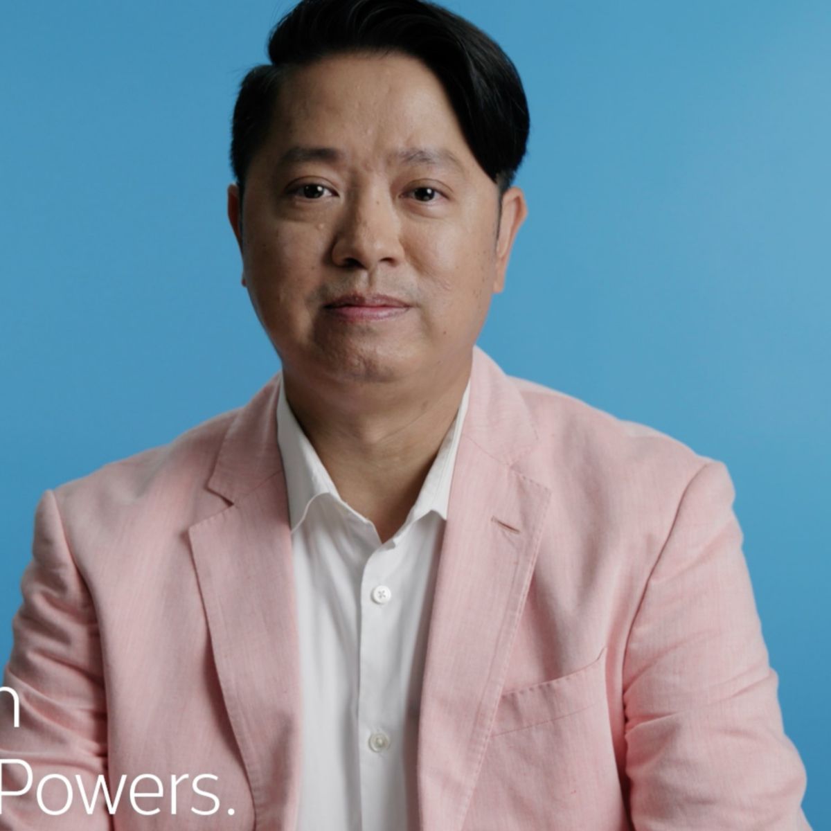 Close up of Asian American real estate agent Man Huynh with video caption
