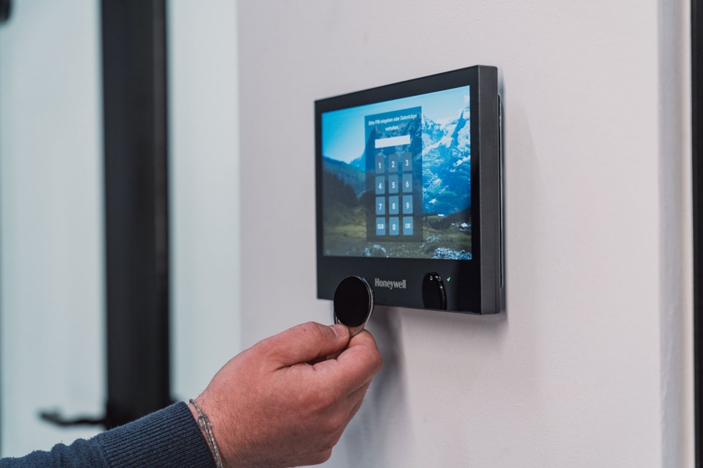 Hand holding device over touchpad