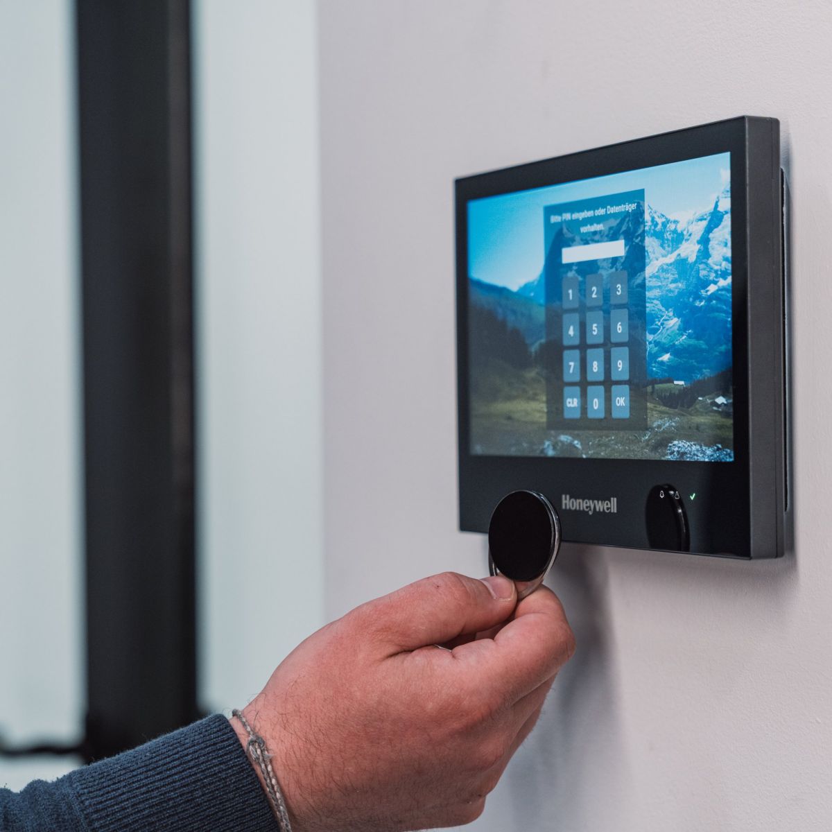 Hand holding device over touchpad