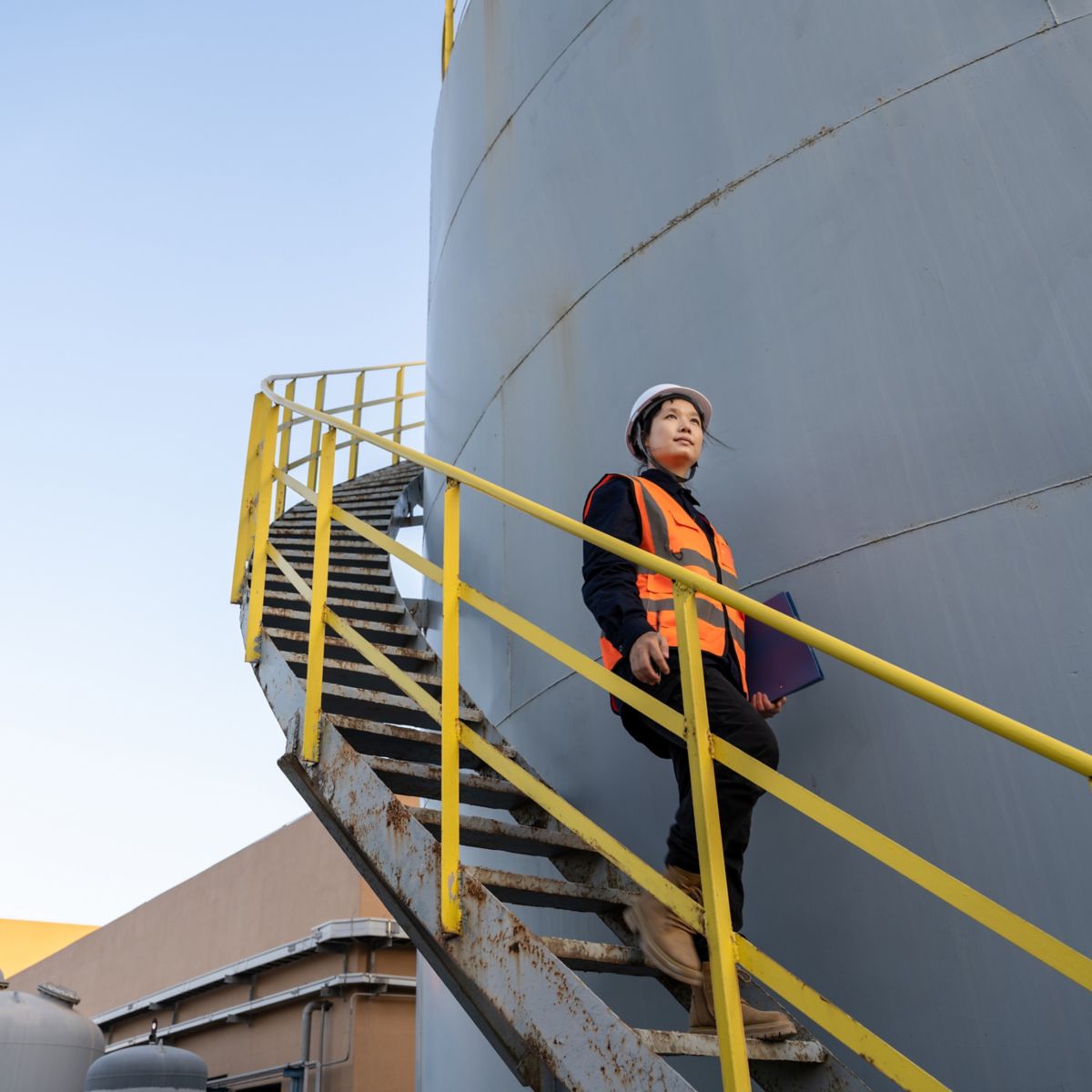 A female engineer works in a chemical plant
